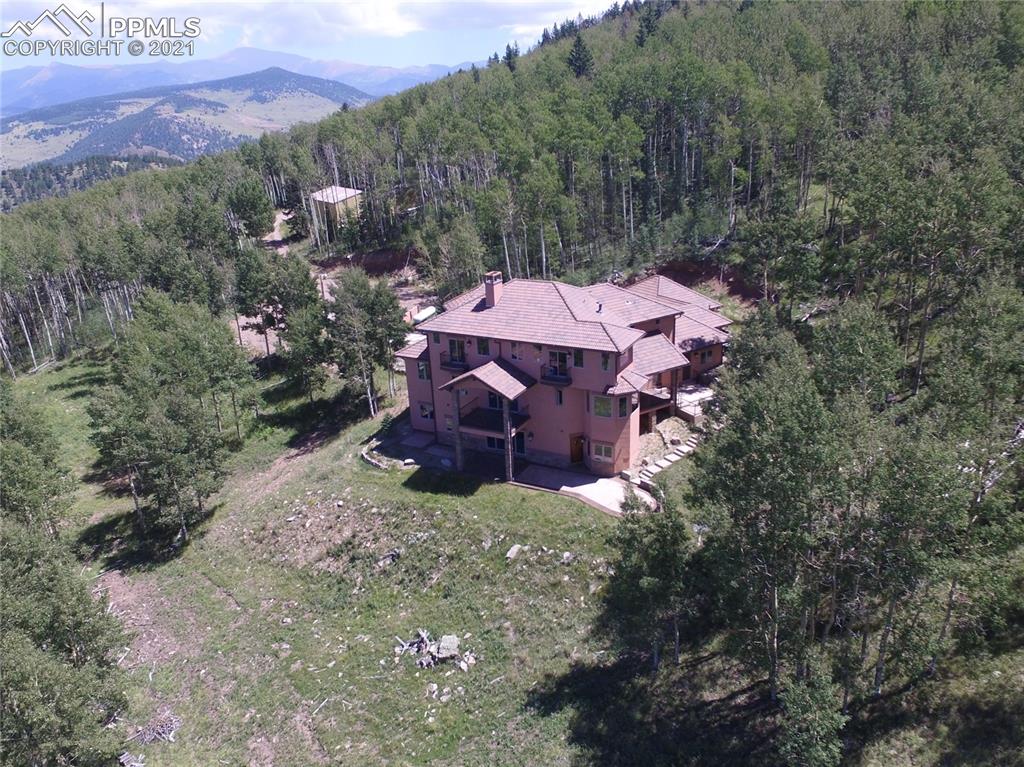 2017 County Road 1 Road Cripple Creek, CO 80813 - Photo 1 of 42 an aerial view of a house with a yard