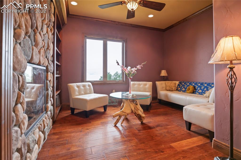 2017 County Road 1 Road Cripple Creek, CO 80813 - Photo 11 of 42 a living room with furniture and a chandelier