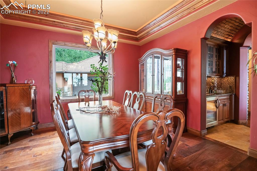 2017 County Road 1 Road Cripple Creek, CO 80813 - Photo 12 of 42 a dining room with furniture a chandelier and window