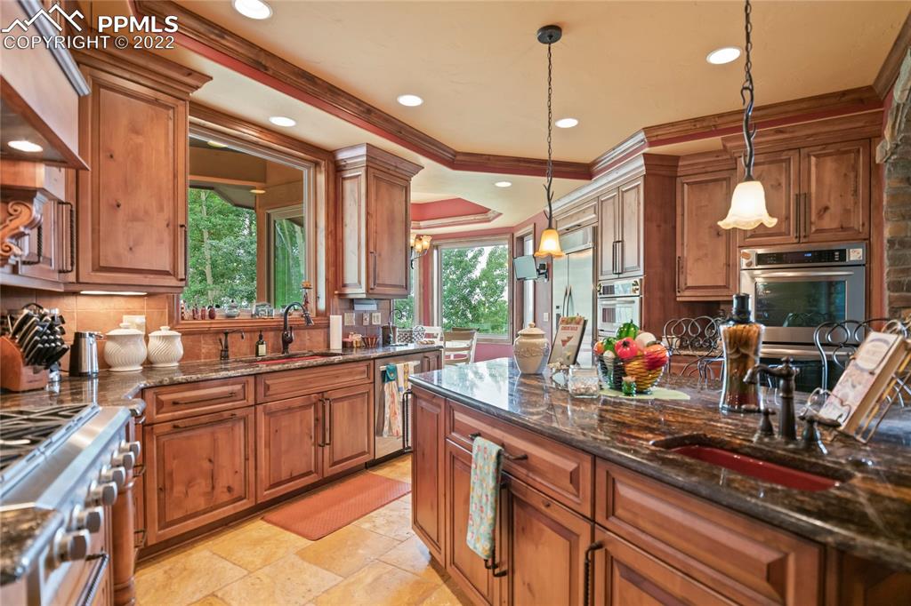 2017 County Road 1 Road Cripple Creek, CO 80813 - Photo 15 of 42 a kitchen with lots of counter top space and a window
