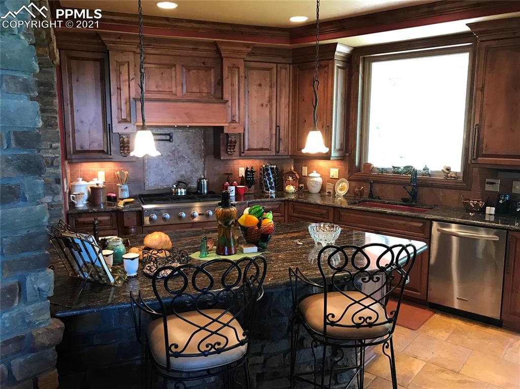 2017 County Road 1 Road Cripple Creek, CO 80813 - Photo 19 of 42 a view of a dining room with furniture and window