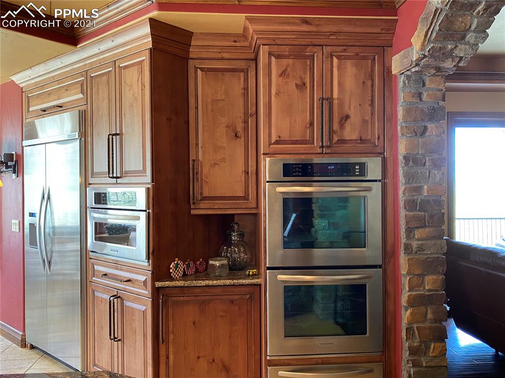 2017 County Road 1 Road Cripple Creek, CO 80813 - Photo 20 of 42 a kitchen with granite countertop a refrigerator and stove