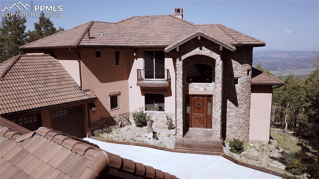 2017 County Road 1 Road Cripple Creek, CO 80813 - Photo 2 of 42 a front view of a house with yard