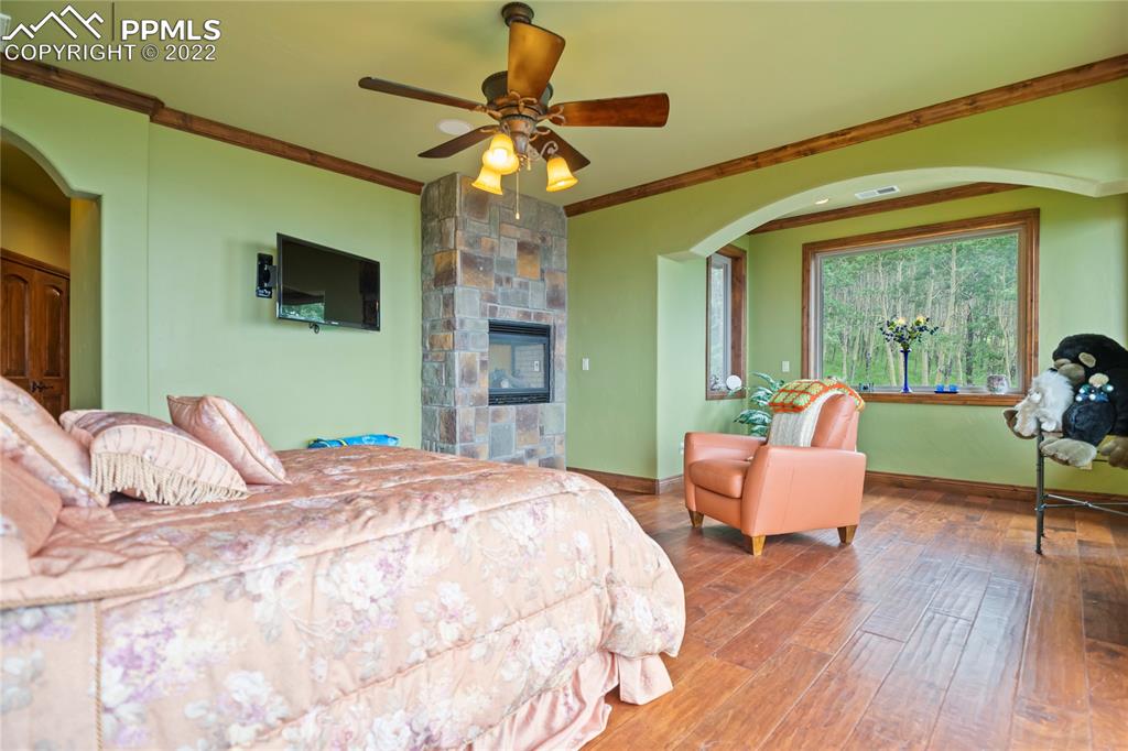 2017 County Road 1 Road Cripple Creek, CO 80813 - Photo 23 of 42 a bedroom with a bed and a chair