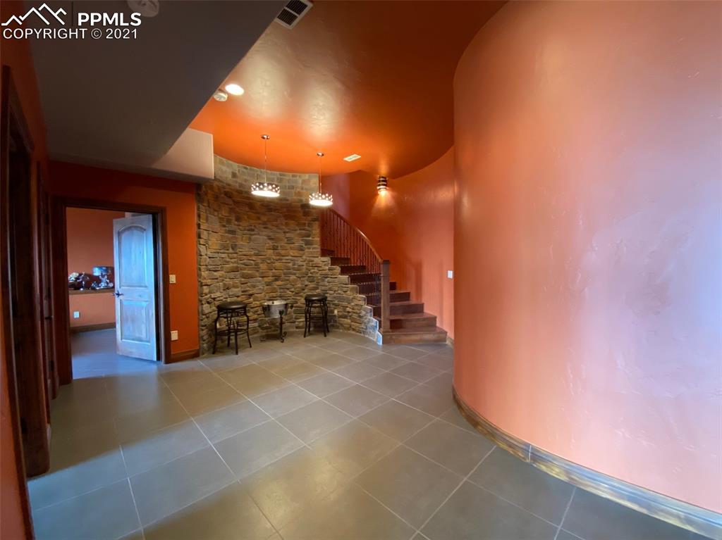 2017 County Road 1 Road Cripple Creek, CO 80813 - Photo 27 of 42 a view of a hallway with seating space