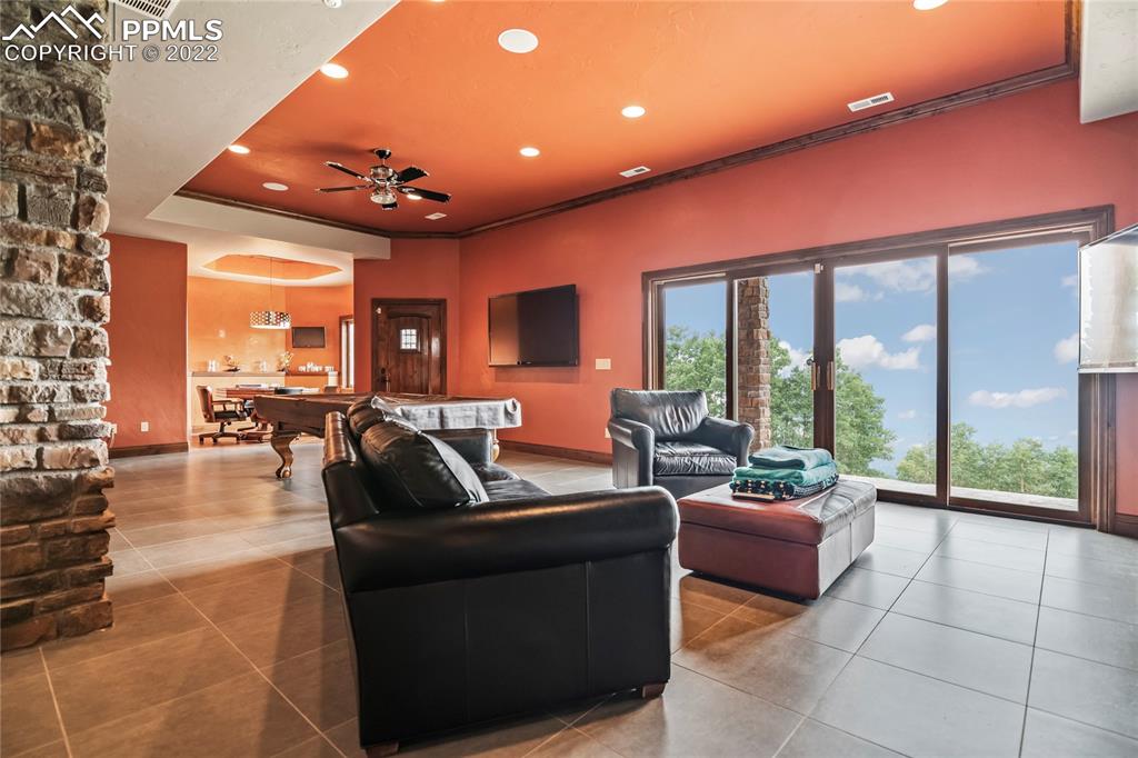 2017 County Road 1 Road Cripple Creek, CO 80813 - Photo 29 of 42 a living room with furniture and a large window