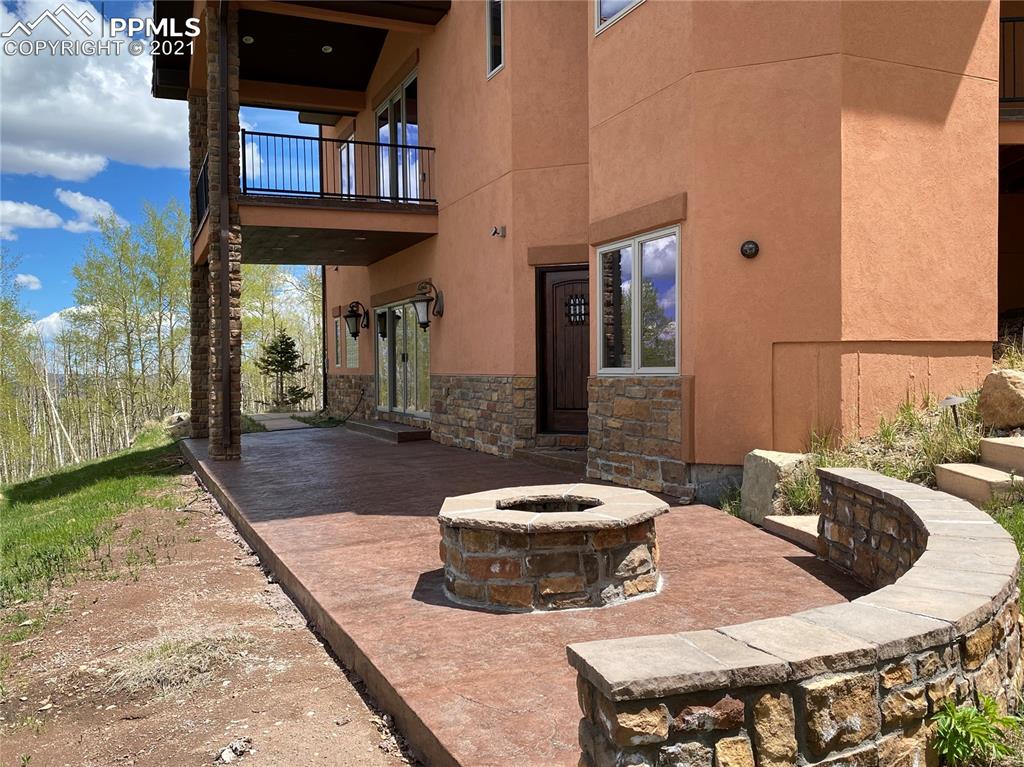 2017 County Road 1 Road Cripple Creek, CO 80813 - Photo 39 of 42 a view of a patio with table and chairs