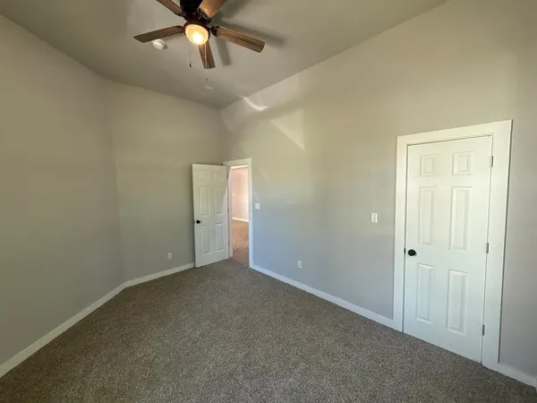 a bathroom with a double vanity sink and mirror with shower