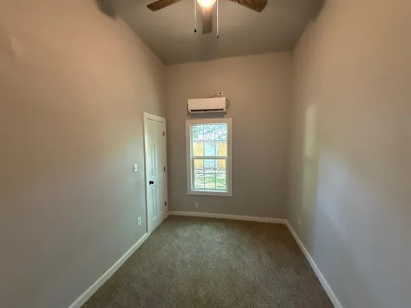 a bedroom with a bed and a tv in it