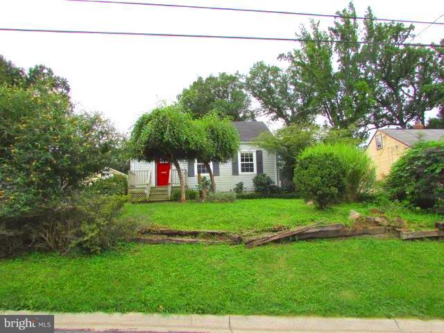 4116 Sampson Road Silver Spring, MD 20906 - Photo 1 of 22 a front view of a house with a yard and trees