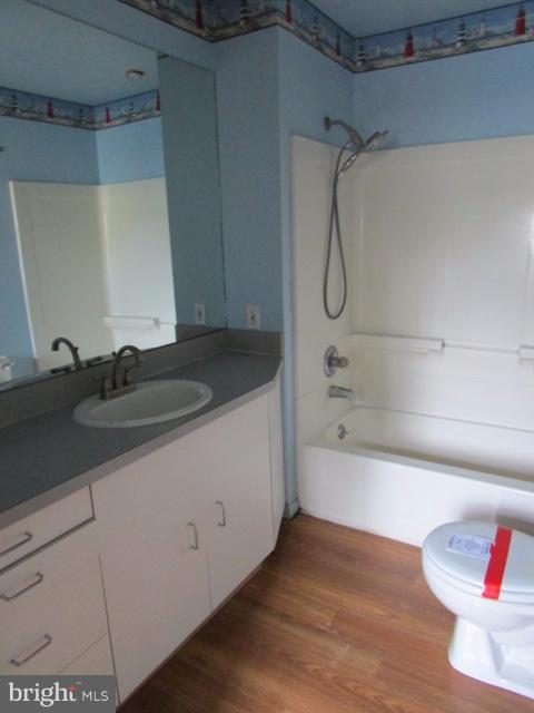 4116 Sampson Road Silver Spring, MD 20906 - Photo 11 of 22 a bathroom with a granite countertop sink a toilet and bathtub