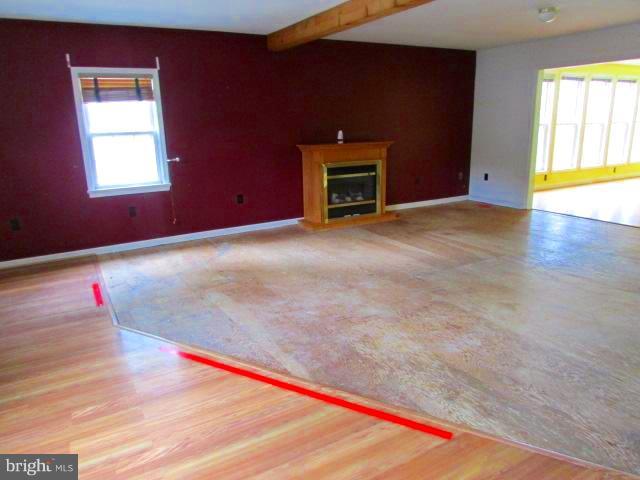 4116 Sampson Road Silver Spring, MD 20906 - Photo 5 of 22 a view of an empty room with a fireplace and a window
