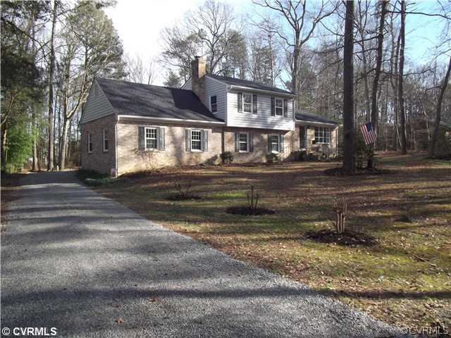 7731 Varann Road Henrico, VA 23231 - Photo 1 of 24 a front view of a house with a yard