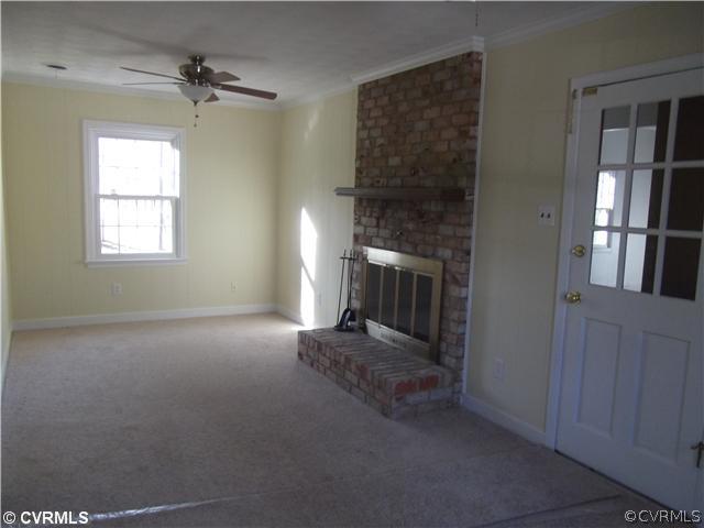 7731 Varann Road Henrico, VA 23231 - Photo 12 of 24 an empty room with windows and fireplace