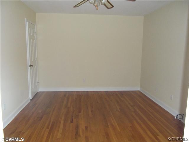 7731 Varann Road Henrico, VA 23231 - Photo 15 of 24 a view of an empty room with wooden floor and a window