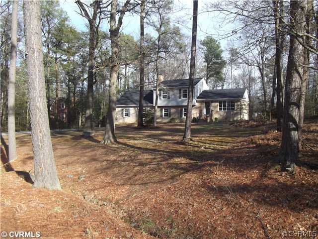 7731 Varann Road Henrico, VA 23231 - Photo 3 of 24 a front view of a house with a yard