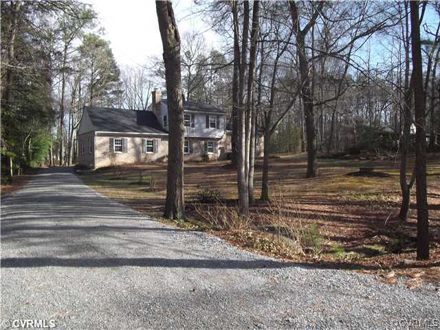 7731 Varann Road Henrico, VA 23231 - Photo 4 of 24 a view of a house with trees