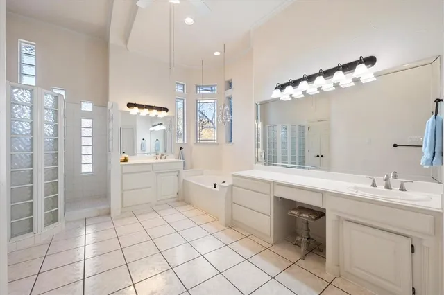 a bathroom with a double vanity sink mirror and
