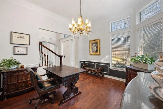 a view of a livingroom with furniture and a chandelier