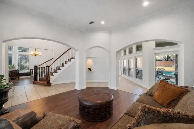 a living room with furniture and a potted plant