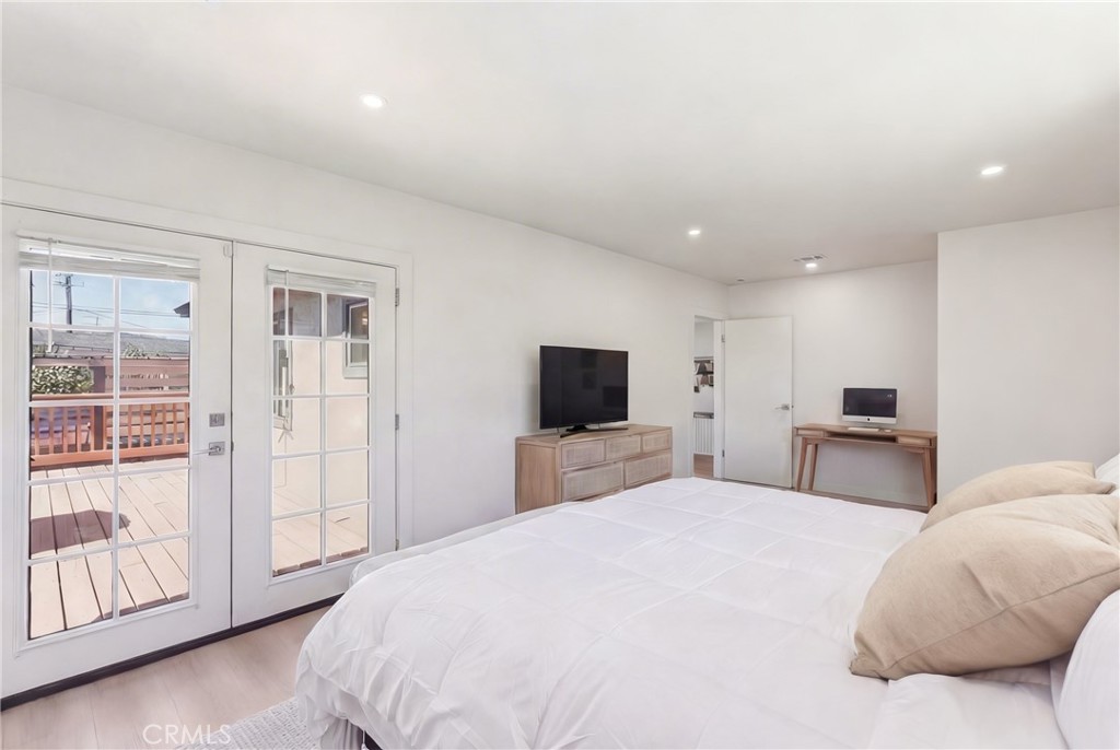 910 Arwin Street Pasadena, CA 91001 - Photo 7 of 23 a bedroom with a large bed and a flat tv screen