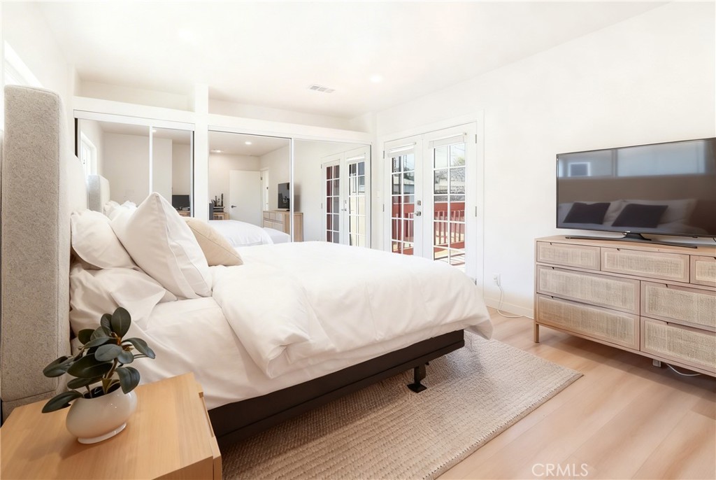 910 Arwin Street Pasadena, CA 91001 - Photo 8 of 23 a bed room with furniture and a flat screen tv