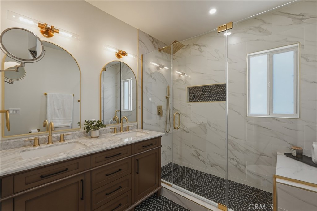 910 Arwin Street Pasadena, CA 91001 - Photo 10 of 23 a bathroom with a double vanity sink mirror and shower