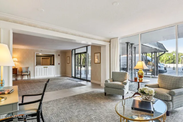 a view of a livingroom with furniture and window