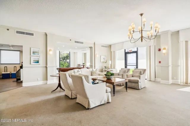 a kitchen with counter top space and living room