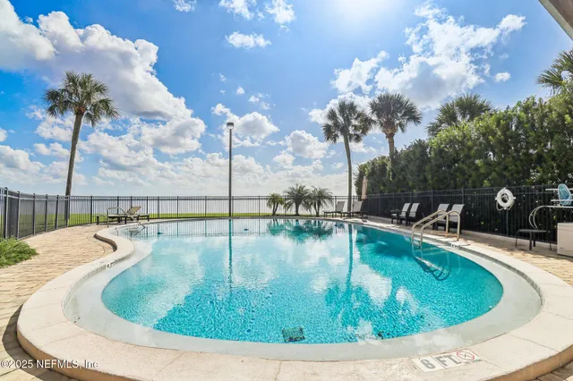 a view of a swimming pool with a porch