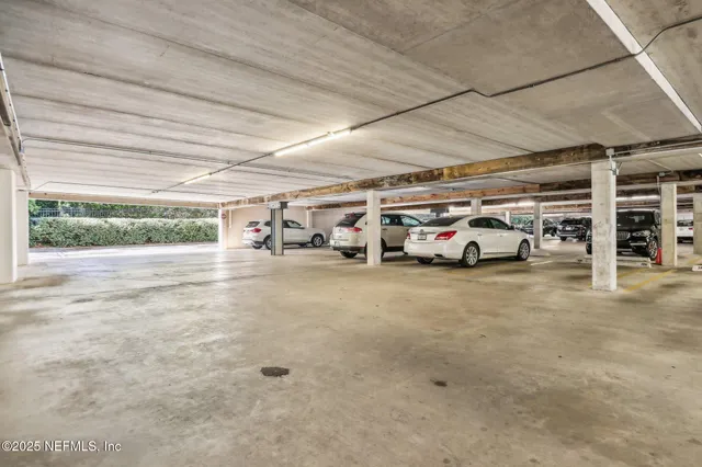 a view of a patio with couches chairs and wooden floor