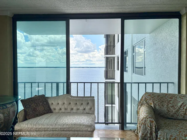 a living room with a couch and a large window