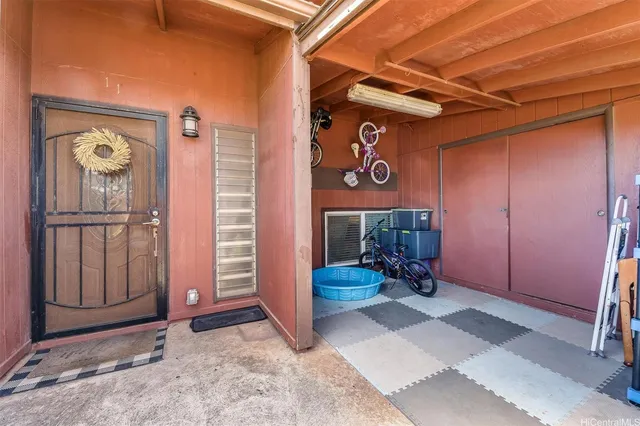 a view of front door with table and chairs