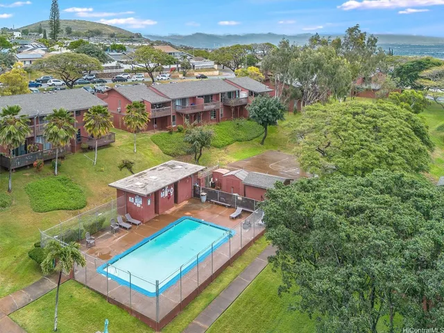 an aerial view of a house with a big yard