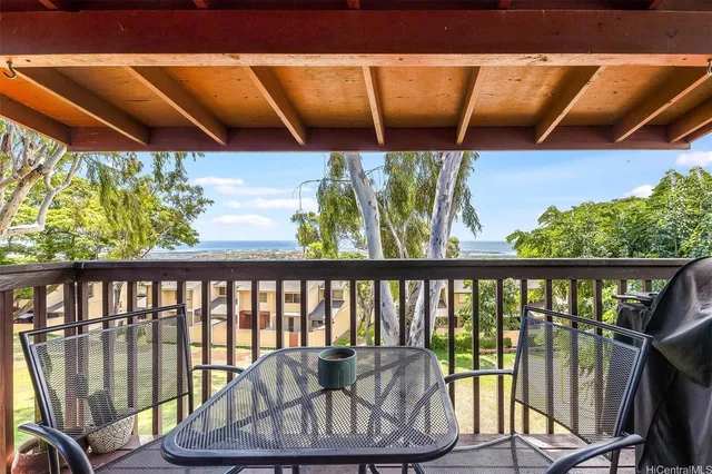a view of roof deck with furniture