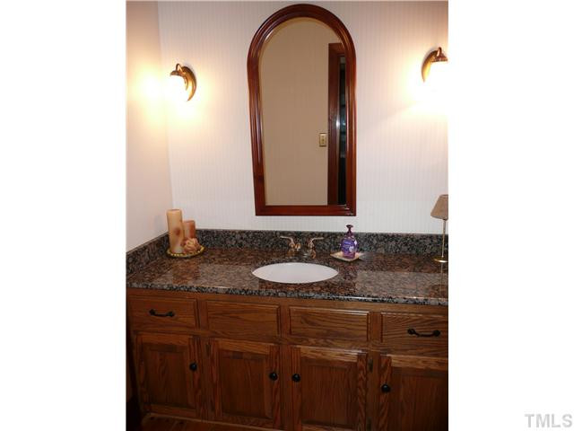 10300 Whitestone Road Raleigh, NC 27615 - Photo 9 of 25 Updated powder room on 1st floor. Granite counters and hardwood floor Half Bath