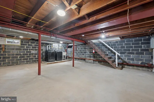 a view of empty room with wooden ceiling
