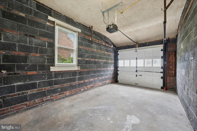 a view of an empty room with windows