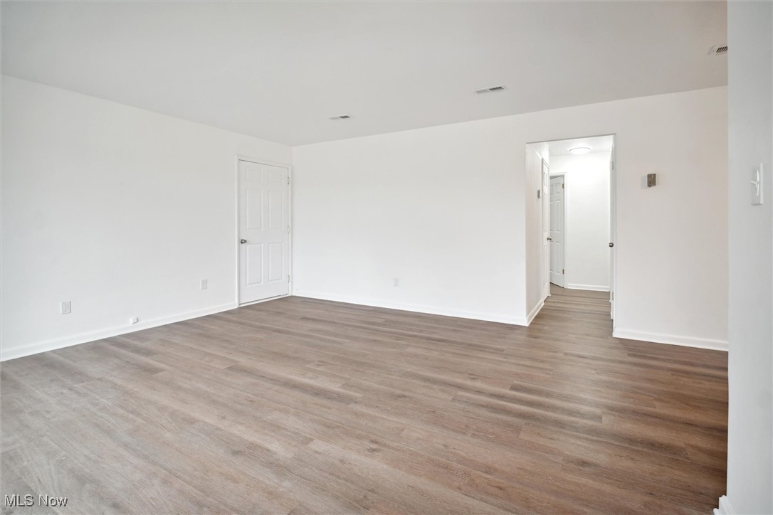 8796 West Ridgewood Drive Cleveland, OH 44130 - Photo 9 of 38 Empty room featuring hardwood / wood-style floors