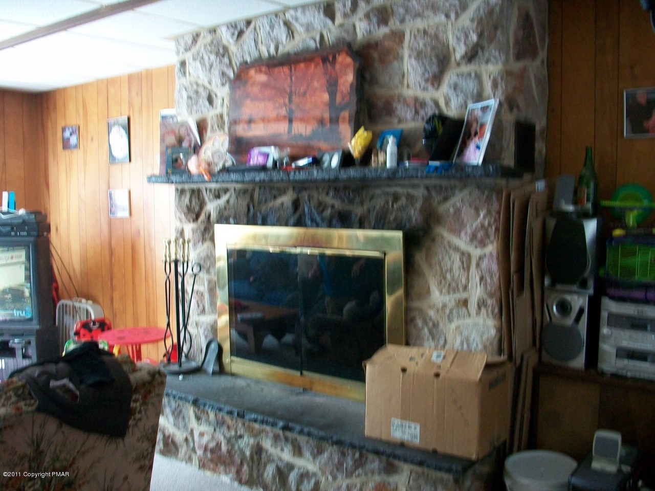Merwinsburg Road Effort, PA 18330 - Photo 6 of 13 a living room with furniture and a fireplace