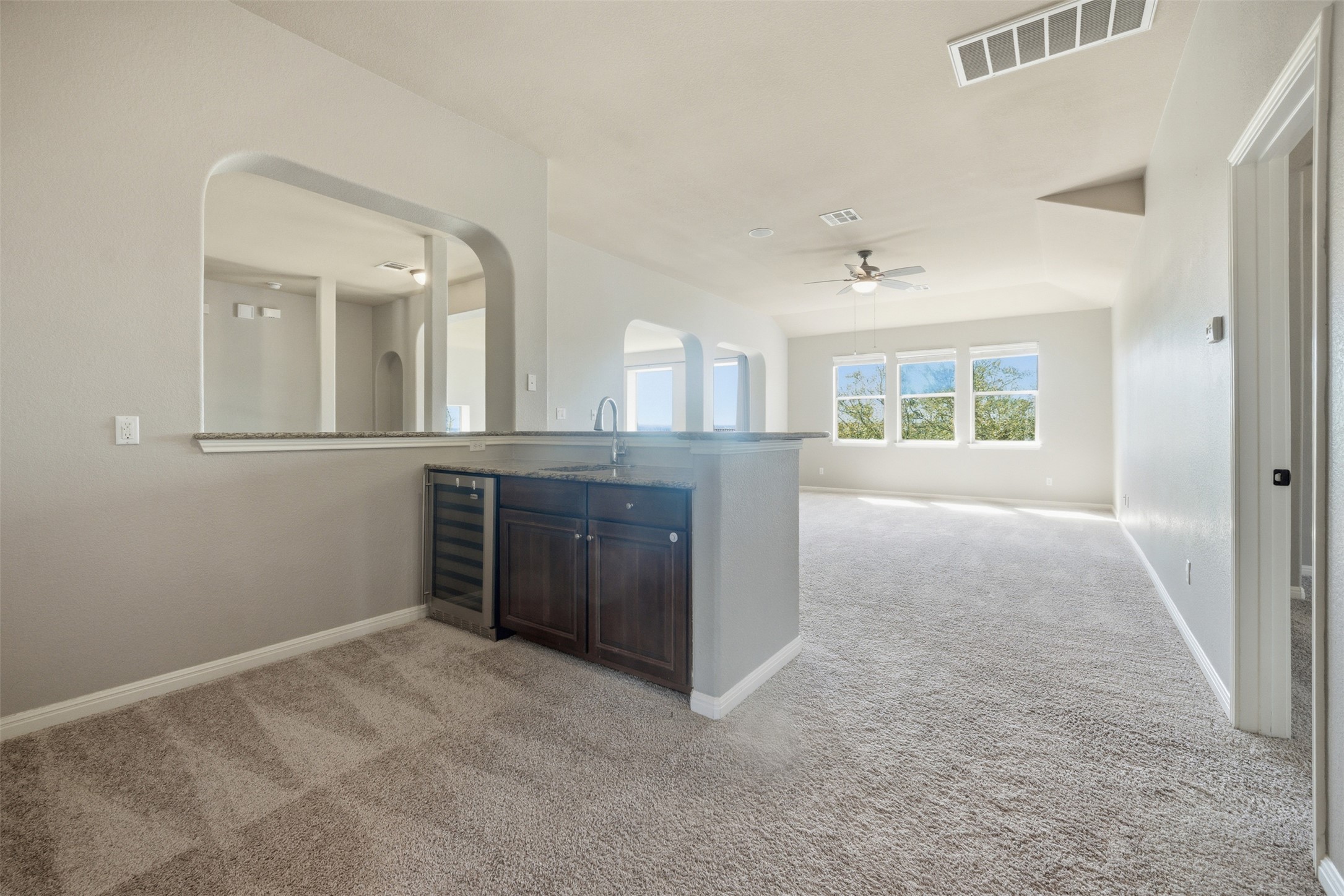 16100 Spillman Ranch Loop Austin, TX 78738 - Photo 30 of 39 view of an empty room with a kitchen