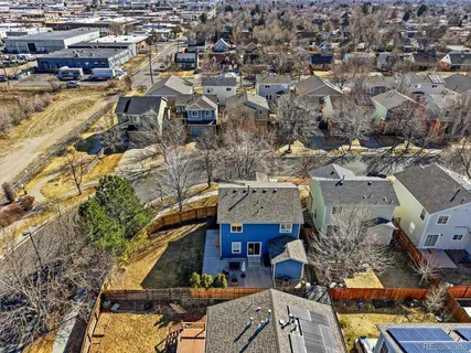 an aerial view of residential houses with outdoor space