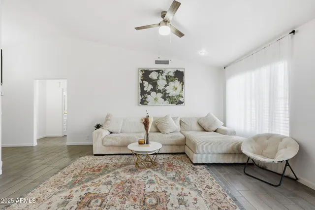 a living room with furniture and a rug