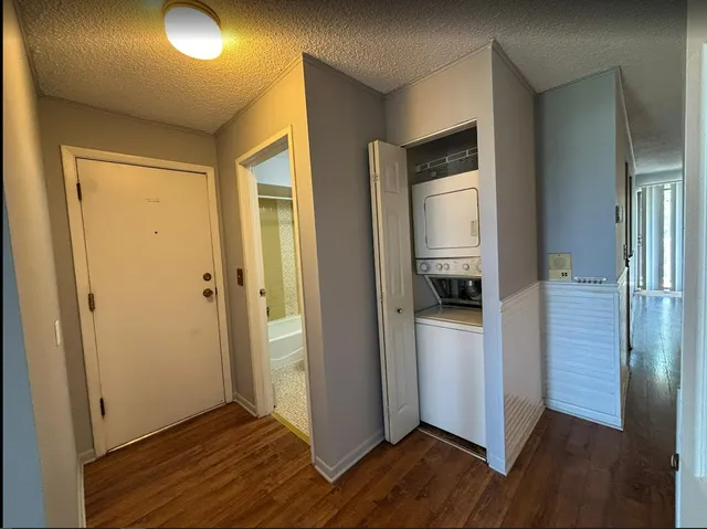 a view of a kitchen from a hallway
