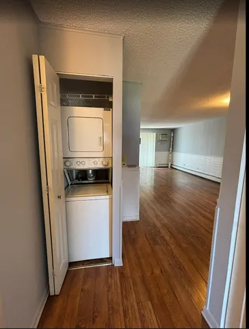 a room with wooden floor and utility