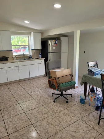 a kitchen with a stove and a sink