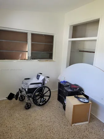 a room with furniture and a window