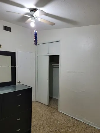 a view of a room with a fan