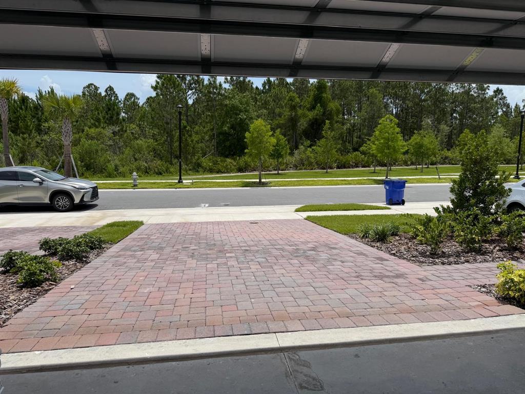 4244 Ranch House Road St. Cloud, FL 34772 - Photo 27 of 34 a front view of a house with garden