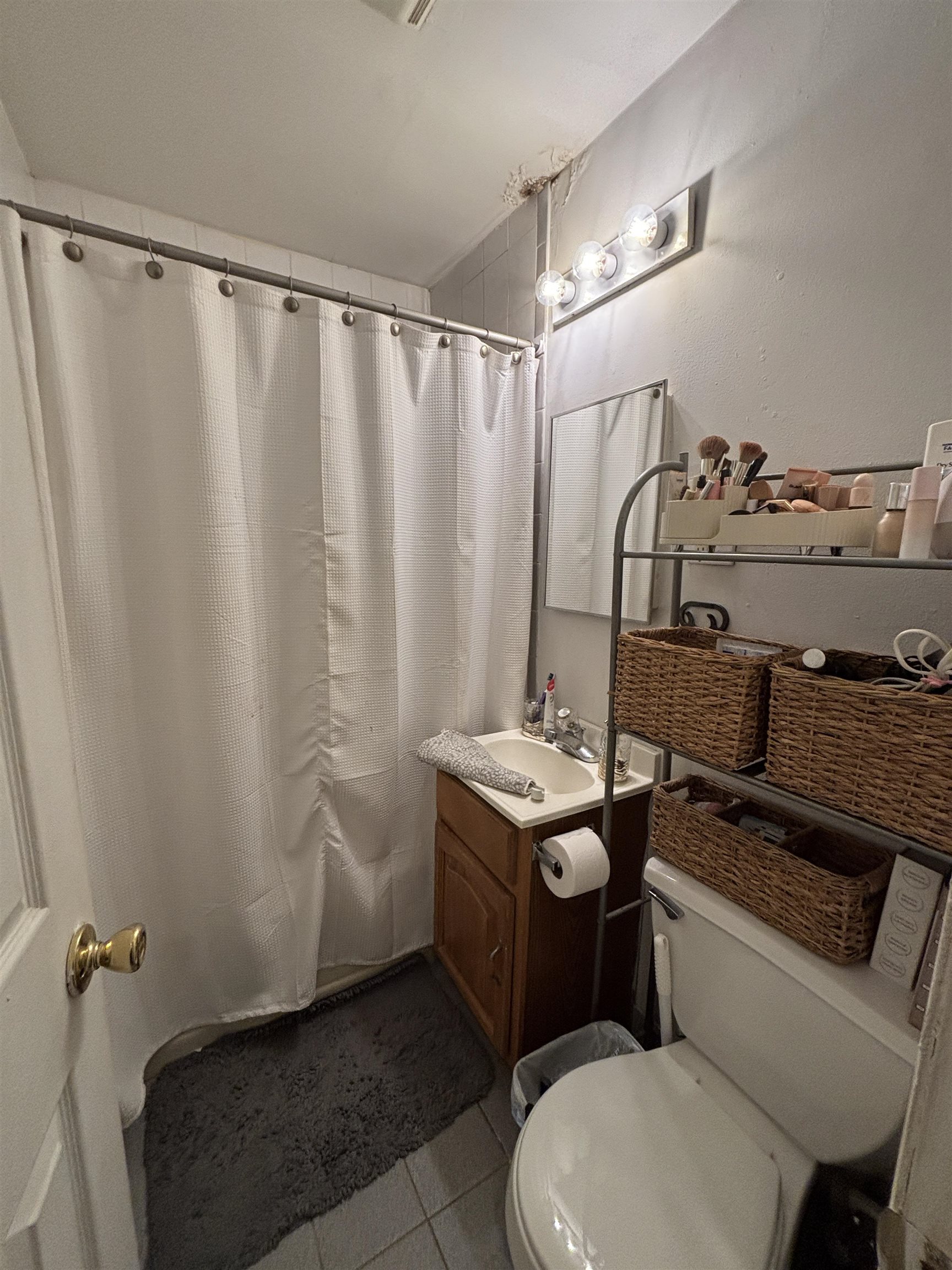 410 Washington Street, Unit 7 Hoboken, NJ 07030 - Photo 4 of 6 a bathroom with a sink toilet and shower